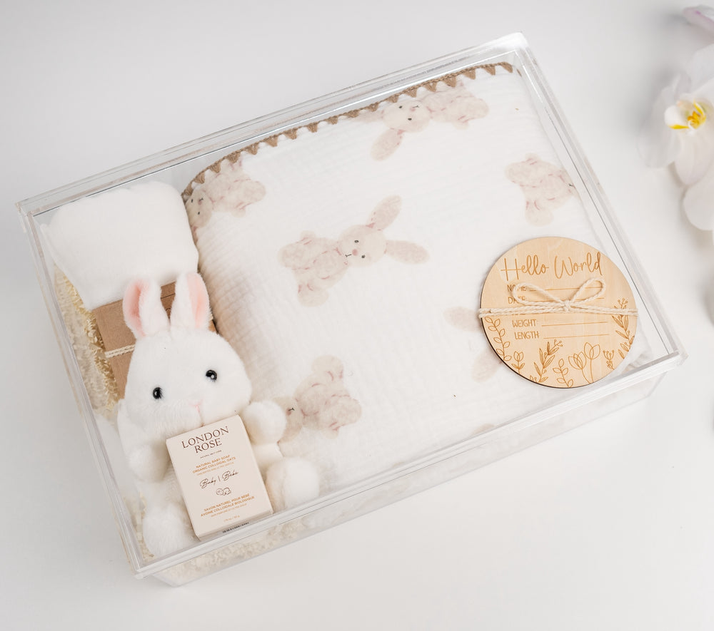 Luxury Cozy Bunny quilt gift basket with plush quilt, swaddle, bunny plush, and baby essentials, ready to gift.