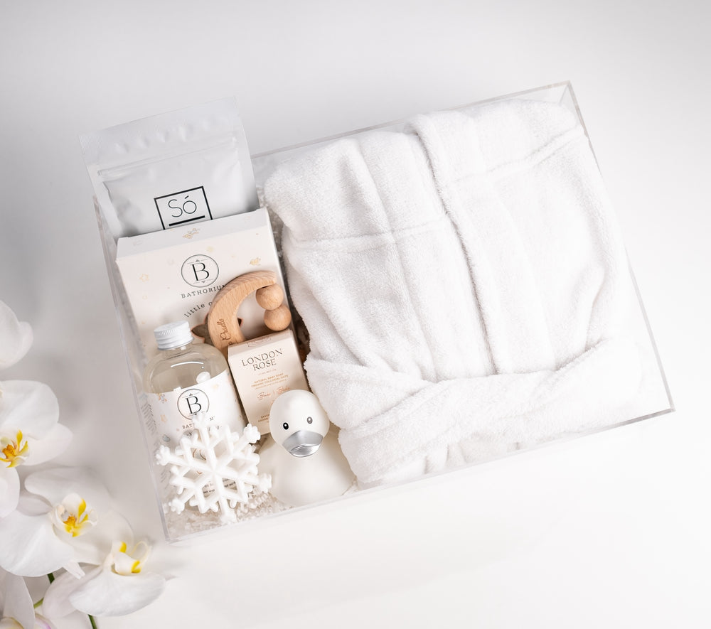Luxury toddler bathrobe gift basket with plush robe, bath essentials, and accessories, elegantly packaged and ready to gift.